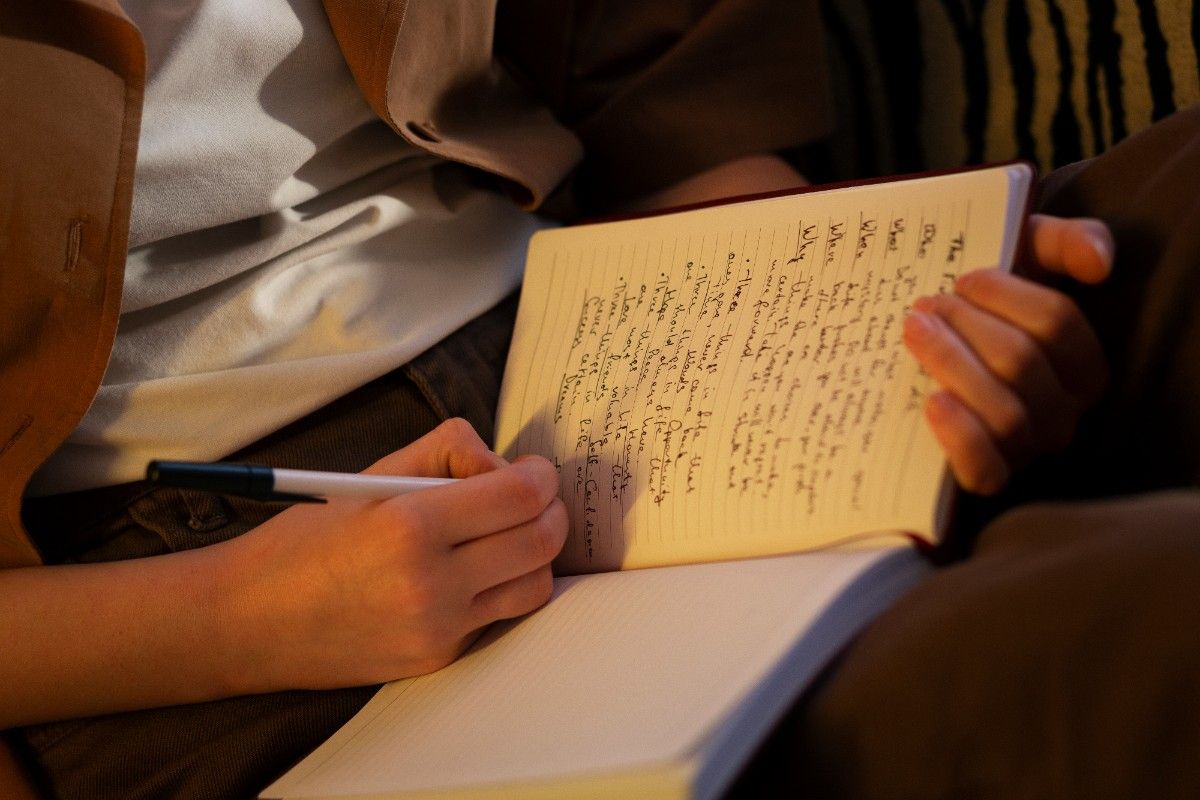 side-view-woman-with-journal-home (1)